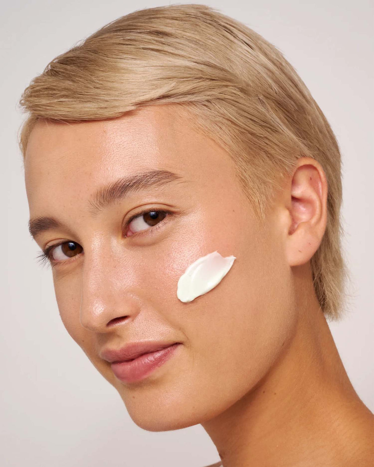 Model with product applied to her skin